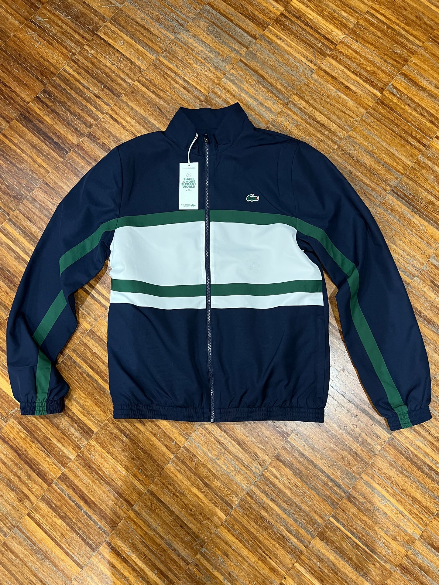 tuta Lacoste microfibra