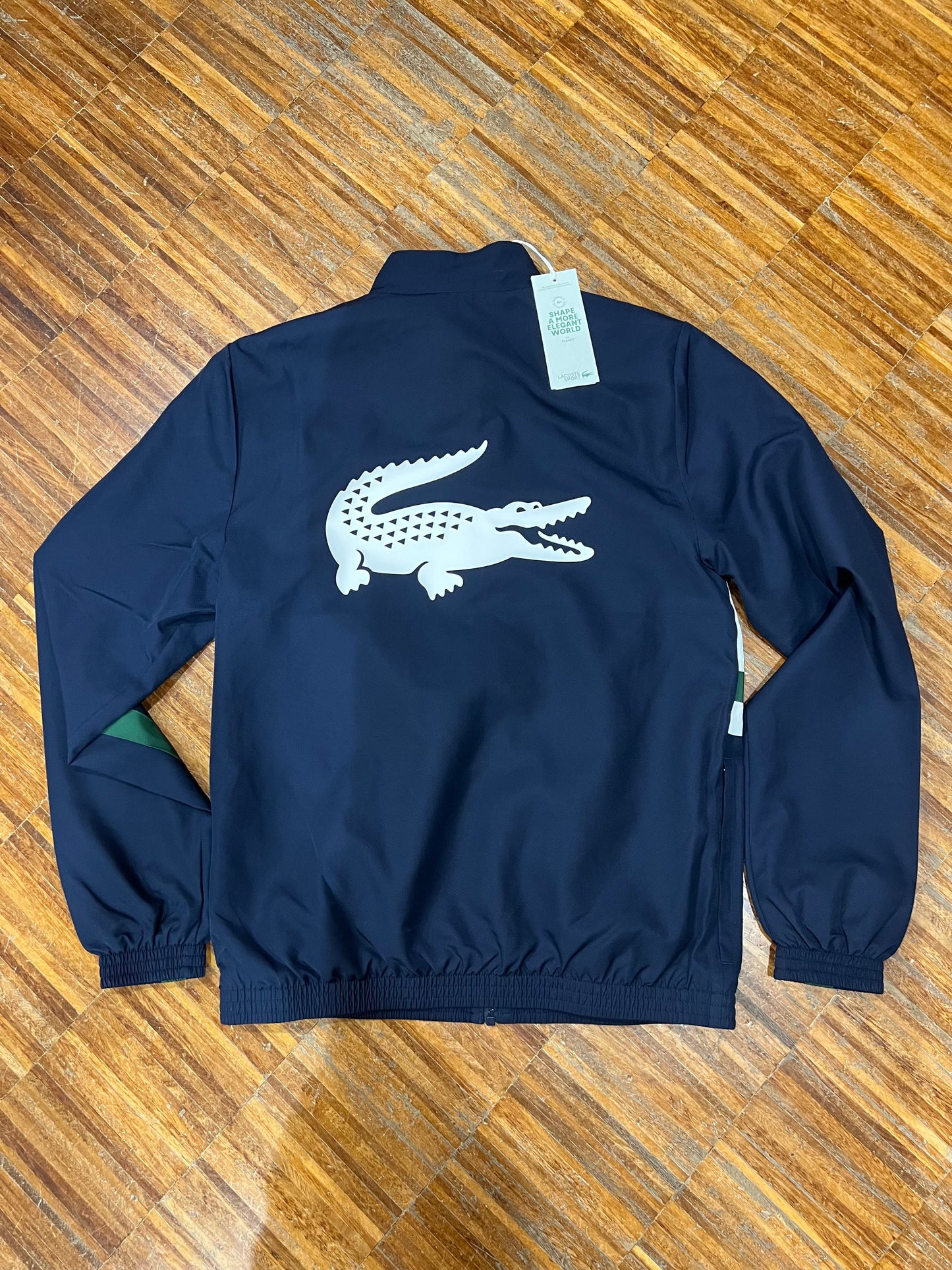 tuta Lacoste microfibra